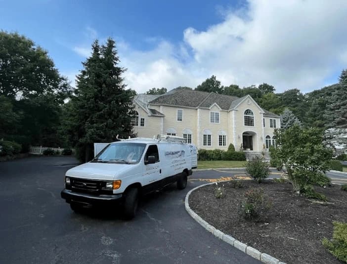 Garfield Heights Power Washing technician performing thorough gutter cleaning service in Garfield Heights