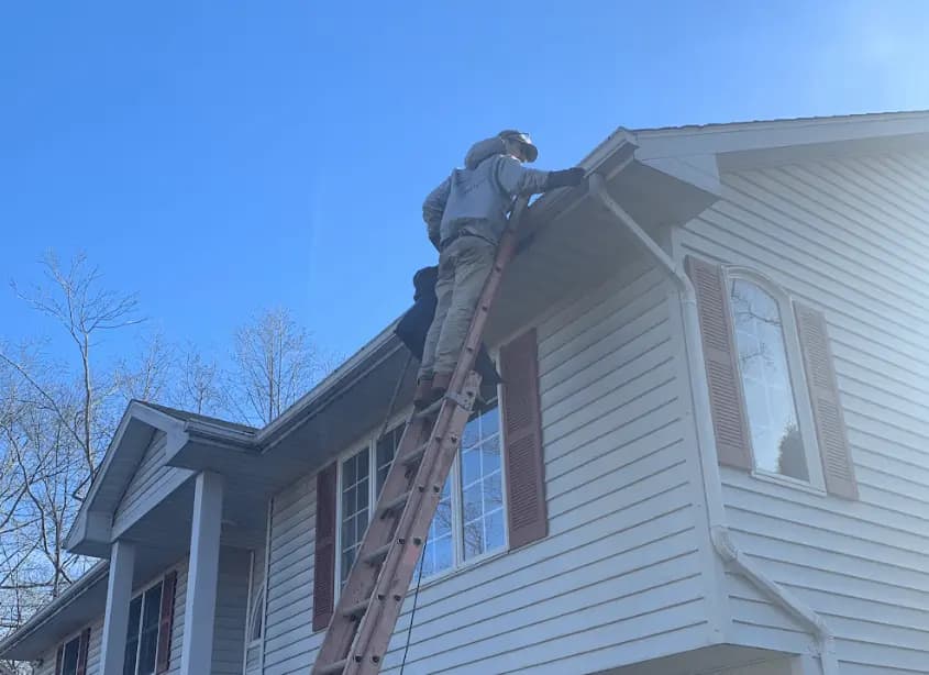 Gutter cleaning and maintenance being performed by Garfield Heights Power Washing in Garfield Heights